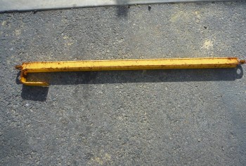 Yellow pallet lifter on gravel
