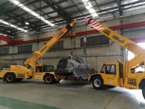 2 cranes lifting machinery